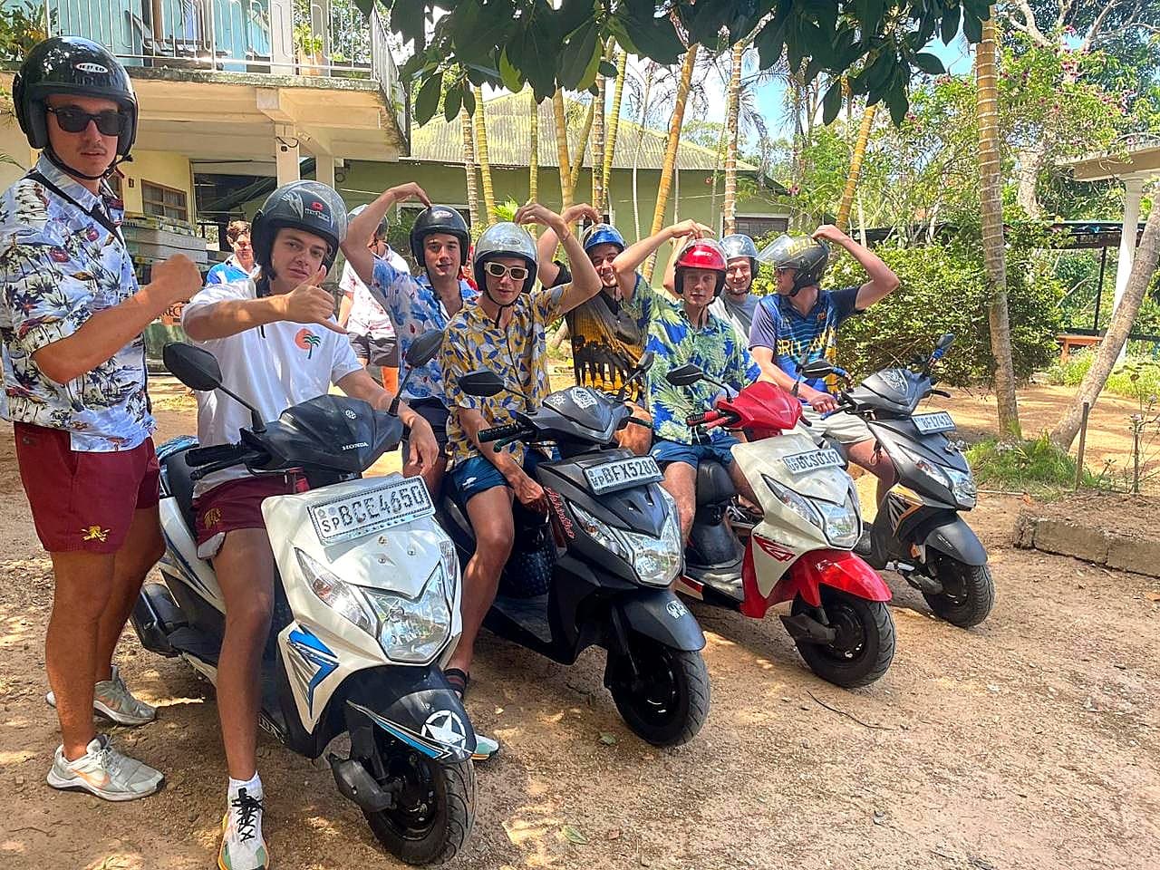 A group of guests heading out on a scooter adventure
