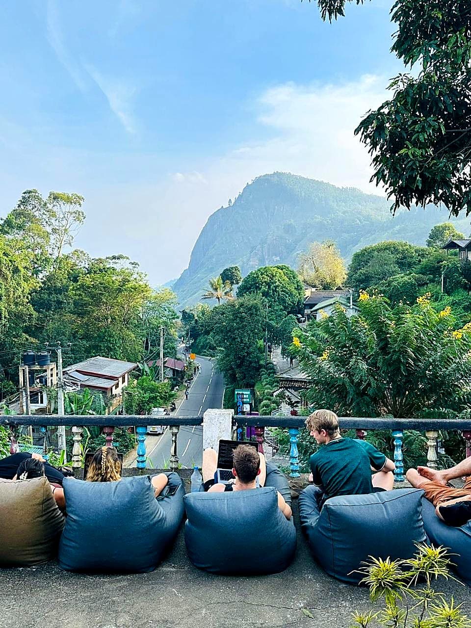 Guests looking out over the valley road toward the mountains