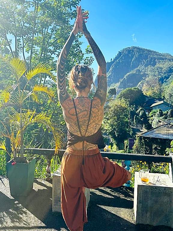 Morning yoga on the terrace overlooking the mountains