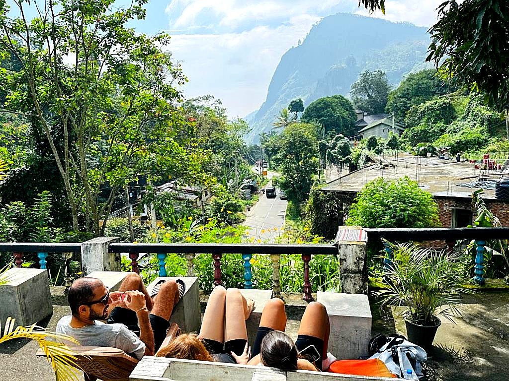 Guests sunbathing on the terrace with mountain and valley views